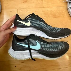 nike zoom pegasus 37 running shoes in blue and black with yellow accent